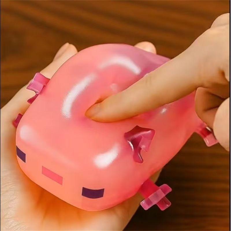 Axolotl animal-shaped squishy toy, a popular internet trend, a stress-relieving gift and gadget.