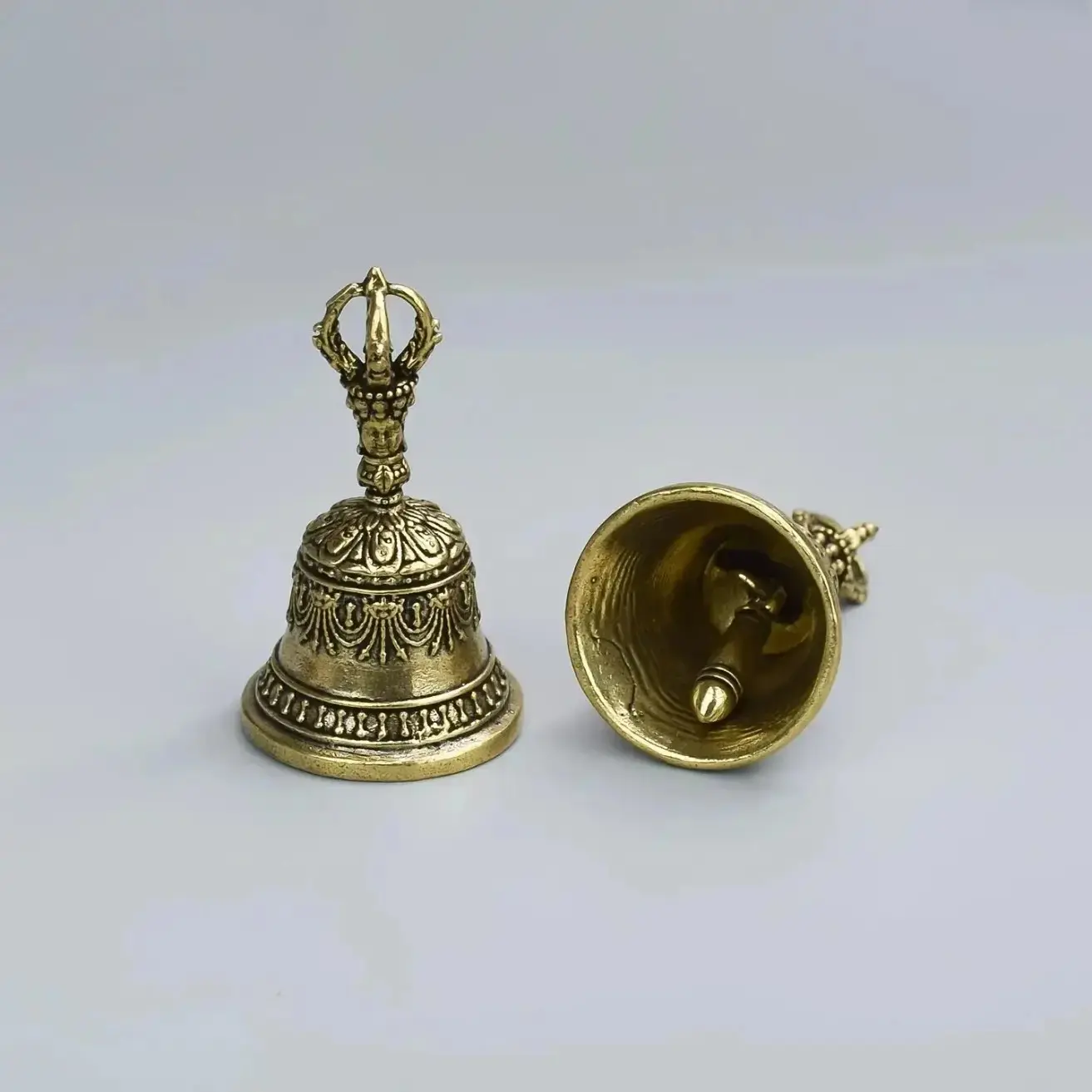 Handcrafted Carved Bronze Hand Bell With Clapper Handle, Premium Handheld Shaker Bell Delivering Soft Calming Tones For Meditation Relaxation, Multi-Purpose Ornament Suitable For Ceremonies Weddings Schools Festivals And Outdoor Holiday Gifts