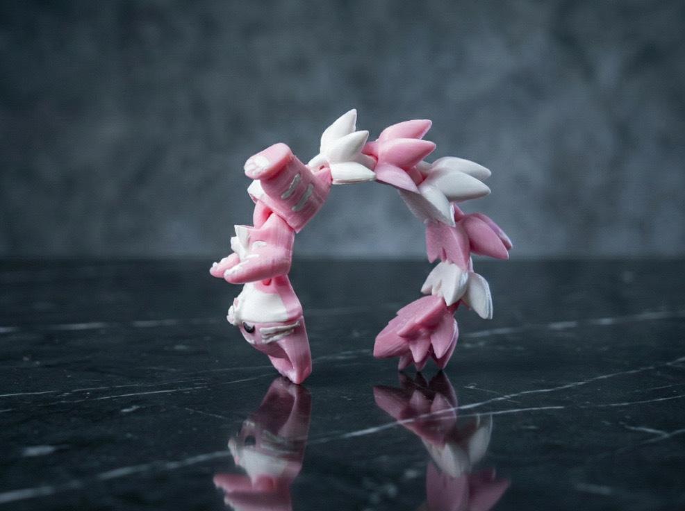 A 3D-printed keychain pendant featuring a cute little fox. The joints of the fox can move freely, making it a popular decorative item.