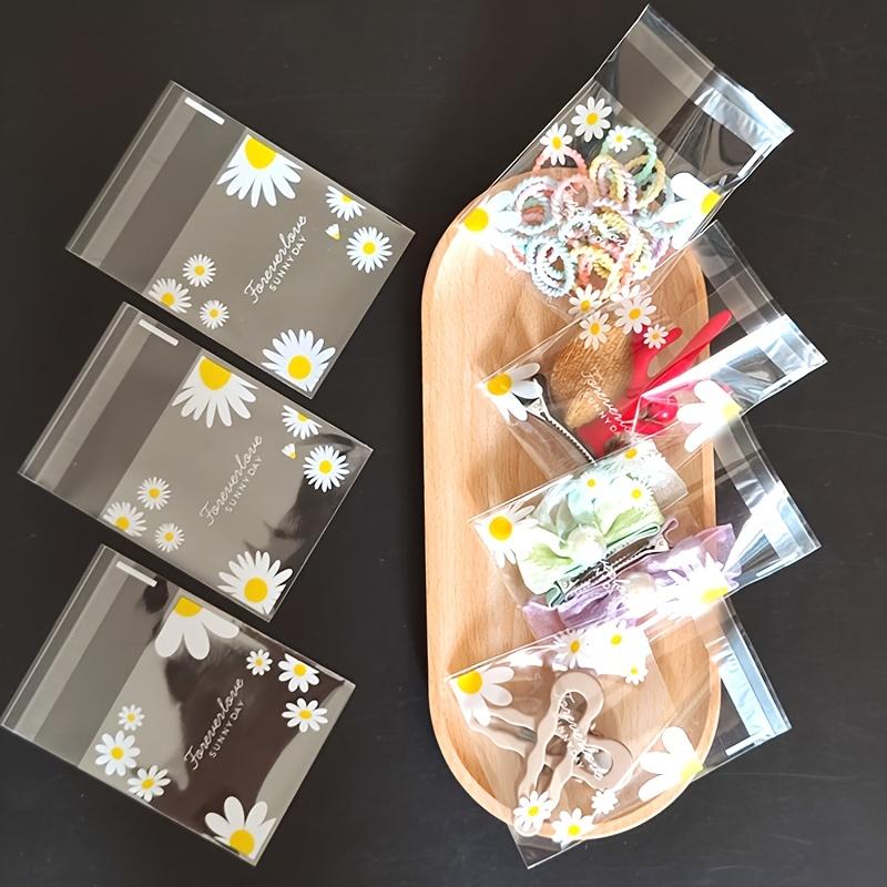 100pcs daisy print gift bag, transparent self-adhesive small packaging bag suitable for wedding return gifts, birthday tea parties, small gift packaging, independent packaging bags for biscuit baking all year round
