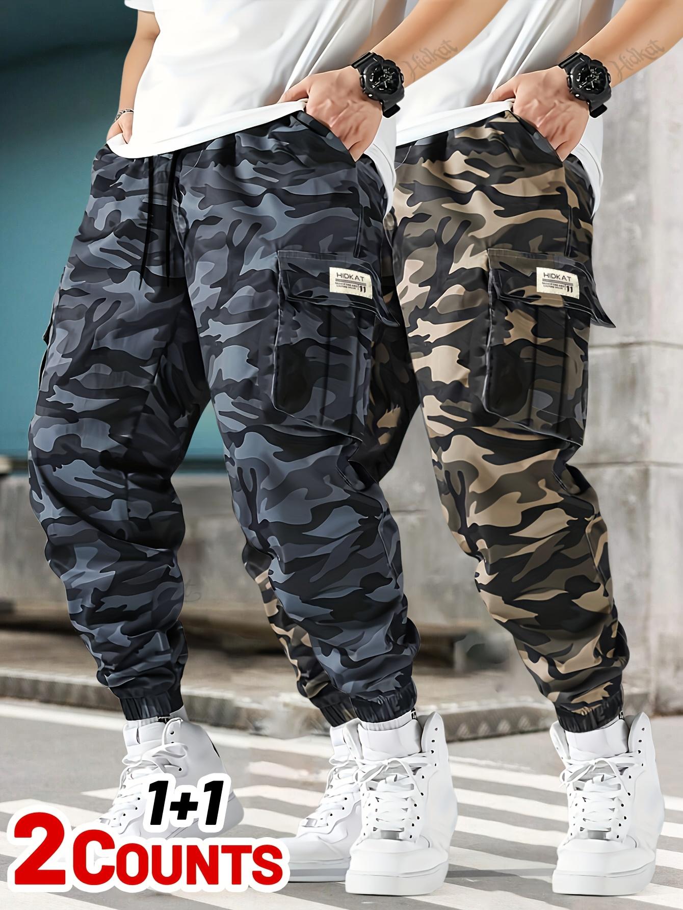 Men's 2-piece camouflage workwear, ankle tied casual pants Multi pocket drawstring elastic waist loose sports work pants two-piece set Outdoor military style camouflage work pants 2-piece combination Men's 2-piece camouflage workwear, ankle tied casual pants Multi pocket drawstring elastic waist loose sports work pants two-piece set Outdoor military style camouflage work pants 2-piece combination