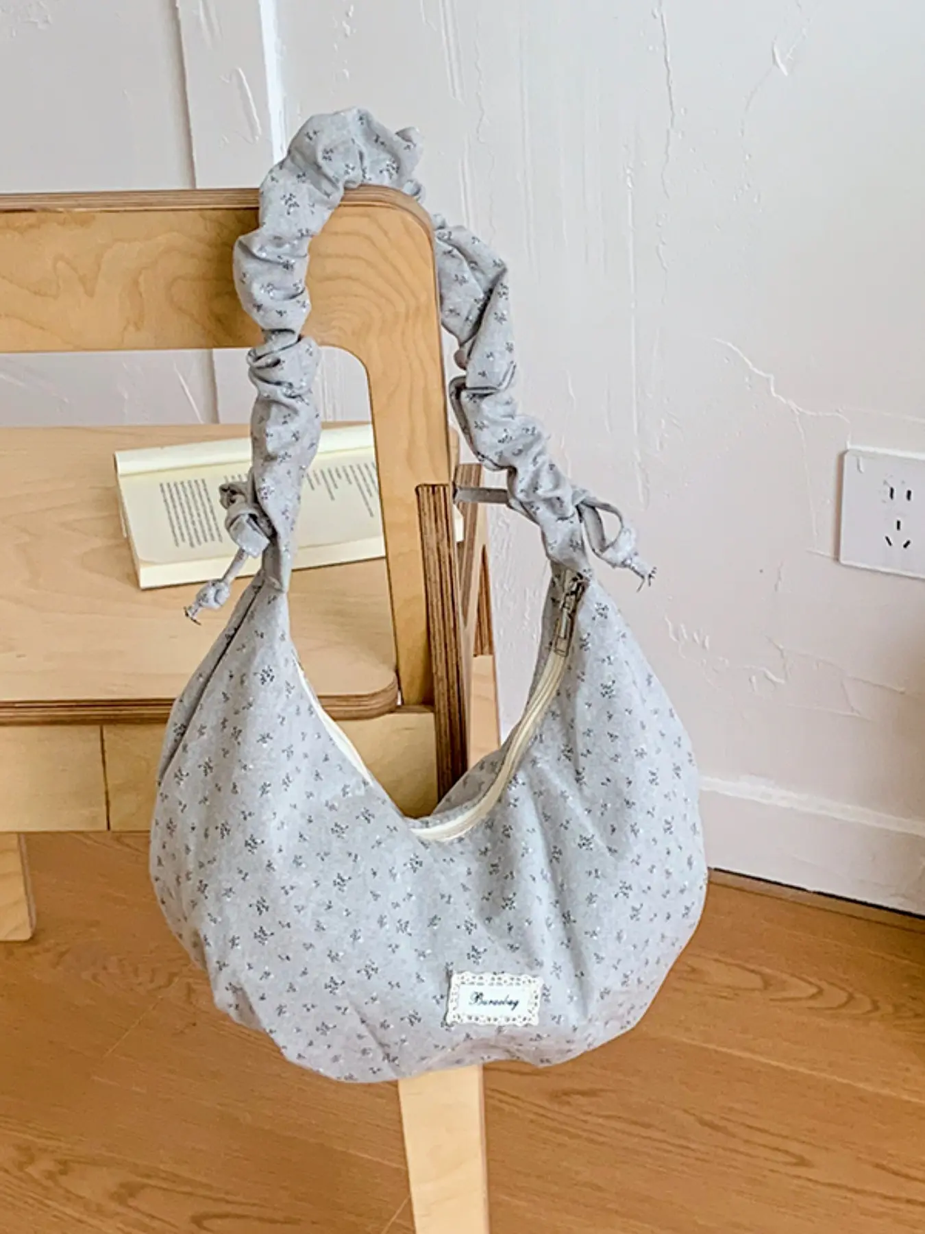 Floral Fabric Crescent Tot Bag, Folded Drawstring Handle, Front Patch Label, Zipper Closure, Soft Material, Spacious, Casual Style