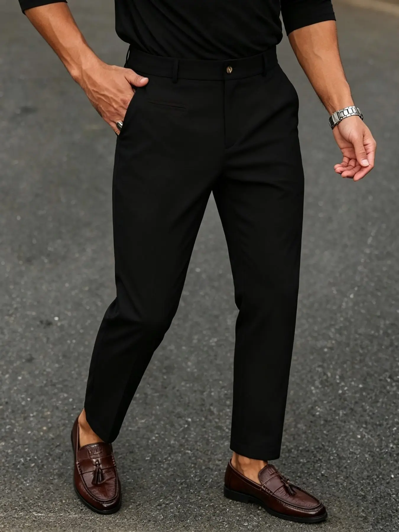 Men's minimalist suit trousers featuring a slim, tapered fit; suitable for both business and casual settings. Crafted from lightweight, breathable woven fabric, these are essential, understated trousers.