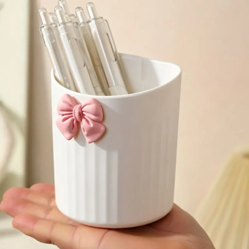 Bow wall hanging storage Cup, no punching paste on the wall does not hurt the wall. With drain holes at the bottom, toiletries are not easy to accumulate water and mold. Vertical texture is durable, toothbrush and toothpaste are placed in the bathroom, an