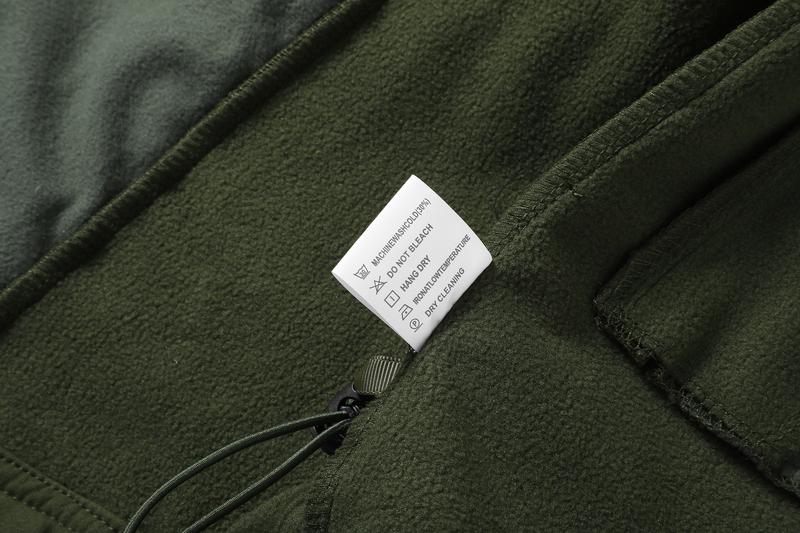 A men's hooded jacket with an outdoor and functional style features multiple zipper pockets distributed on the chest, arms, etc., making it convenient to store various small items and highly practical. Hood with drawstring closure