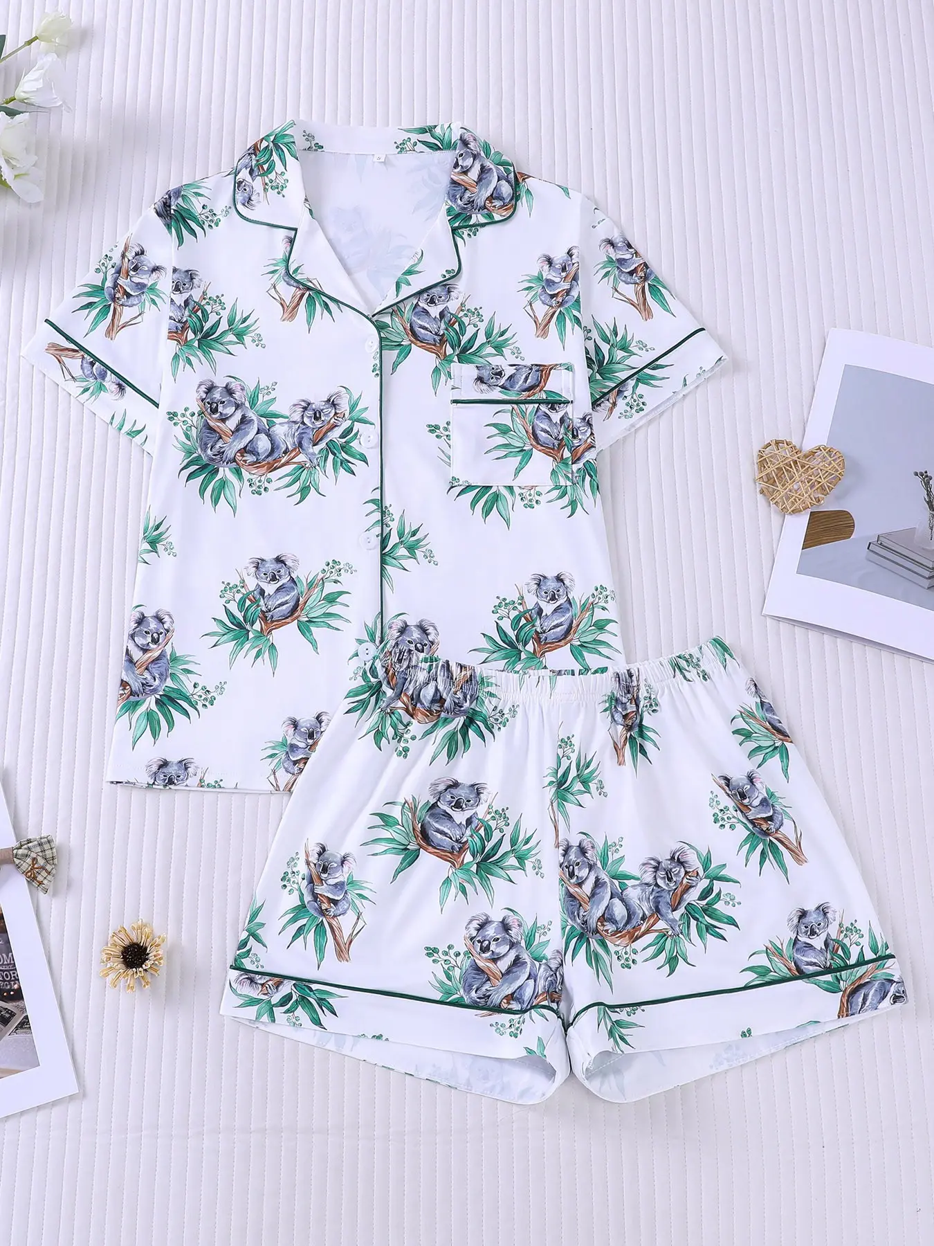Women's 2-piece pajama set with hand-drawn koala & eucalyptus forest all-over prints on white base, green contrast piping, lapel short sleeve top with small pocket, soft elastic waist shorts, casual loungewear, Nightwear for women daily home wear