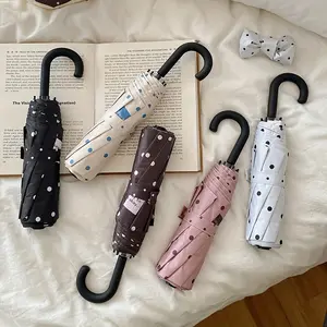 Polka-Dot Colorful Umbrella: A Stylish Accessory with a Convenient U-Shaped Handle for Easy Carrying