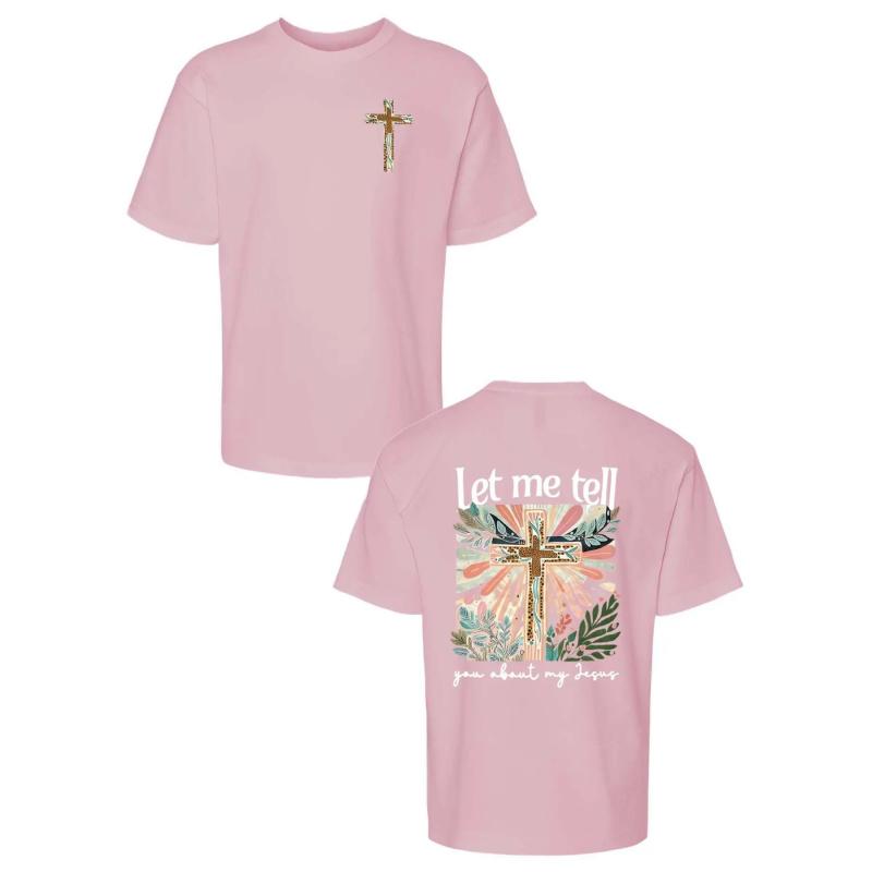 Colorful Graphic Black T-Shirt for Girls - Features Floral Cross Design and Inspirational 'Let me tell you about my Jesus' Text |   Adorned with Pink Hair Clips, Perfect for Casual Wear |   Stylish and Eye-Catching Top for Young Fashionistas