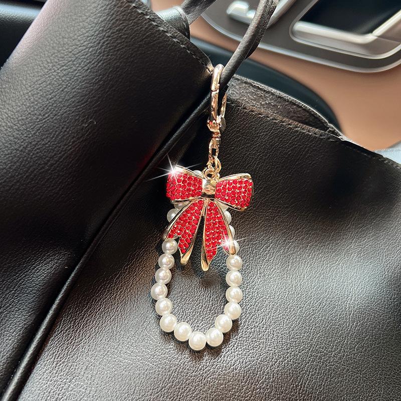 Rhinestone Bow Keychain with Pearl Wrist Strap, Luxury Bling Bow Car Key Ring, Elegant Metal Bag Charm Accessory for Women