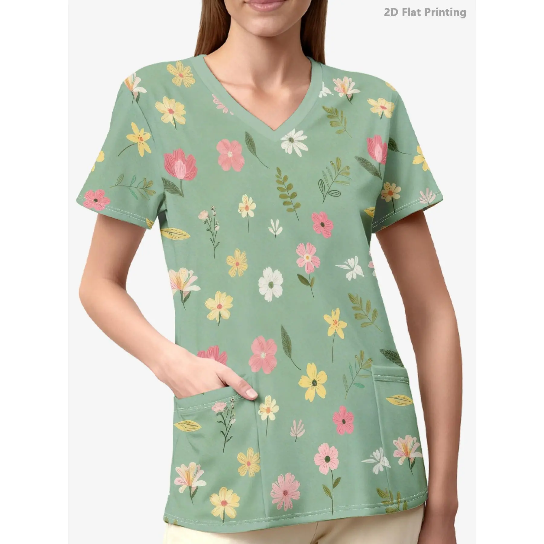 A Women'S Nursing Top Featuring a White Base with an All-Over Print, Two Pockets, And a V-Neck Design. It Has a Light Green Background Adorned with Pastel Flowers And Leaves, Making It Ideal for Various Professional Settings in Healthcare, Dental
