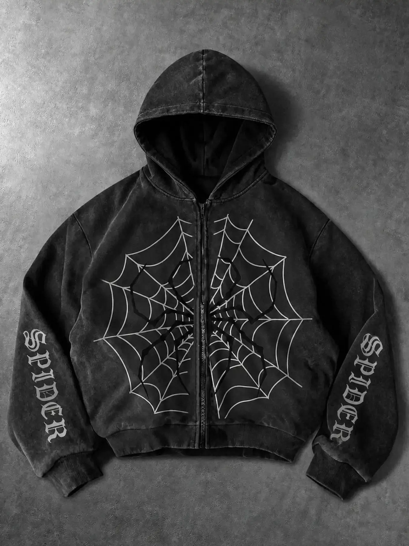 Vintage washed black zip-up hooded jacket, decorated with striking spider and web graphic on front. Gothic letter prints on both sleeves, relaxed cropped fit. Retro worn texture, perfect dark streetwear for fashion outfits.