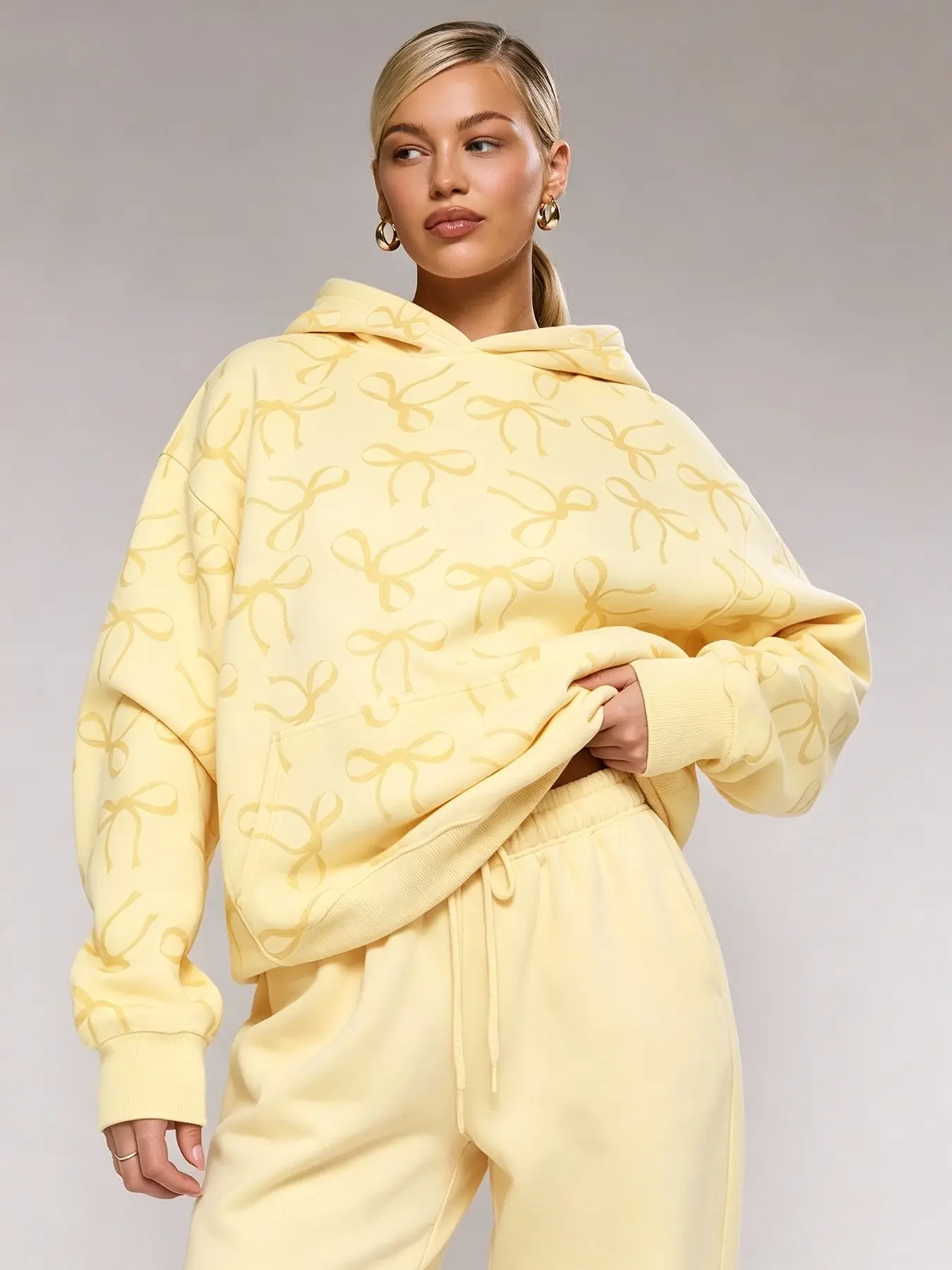 Autumn yellow bow print loose hoodie, casual and comfortable loungewear, perfect for running errands, coffee dates, pajama styling, and street style. Trendy girly sweatshirt, Long Sleeve, #bowprinthoodie #yellowhoodie