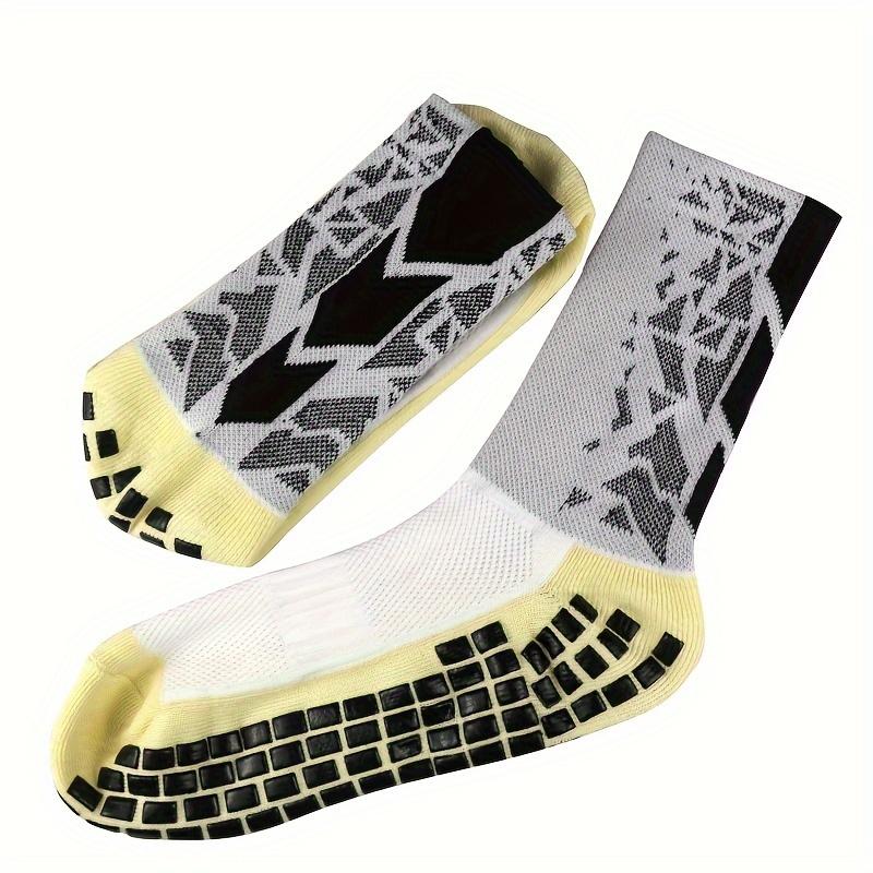 A Pair of Men'S Mid-Calf Football Socks, Designed with a Thick Towel Bottom for Enhanced Grip And Durability