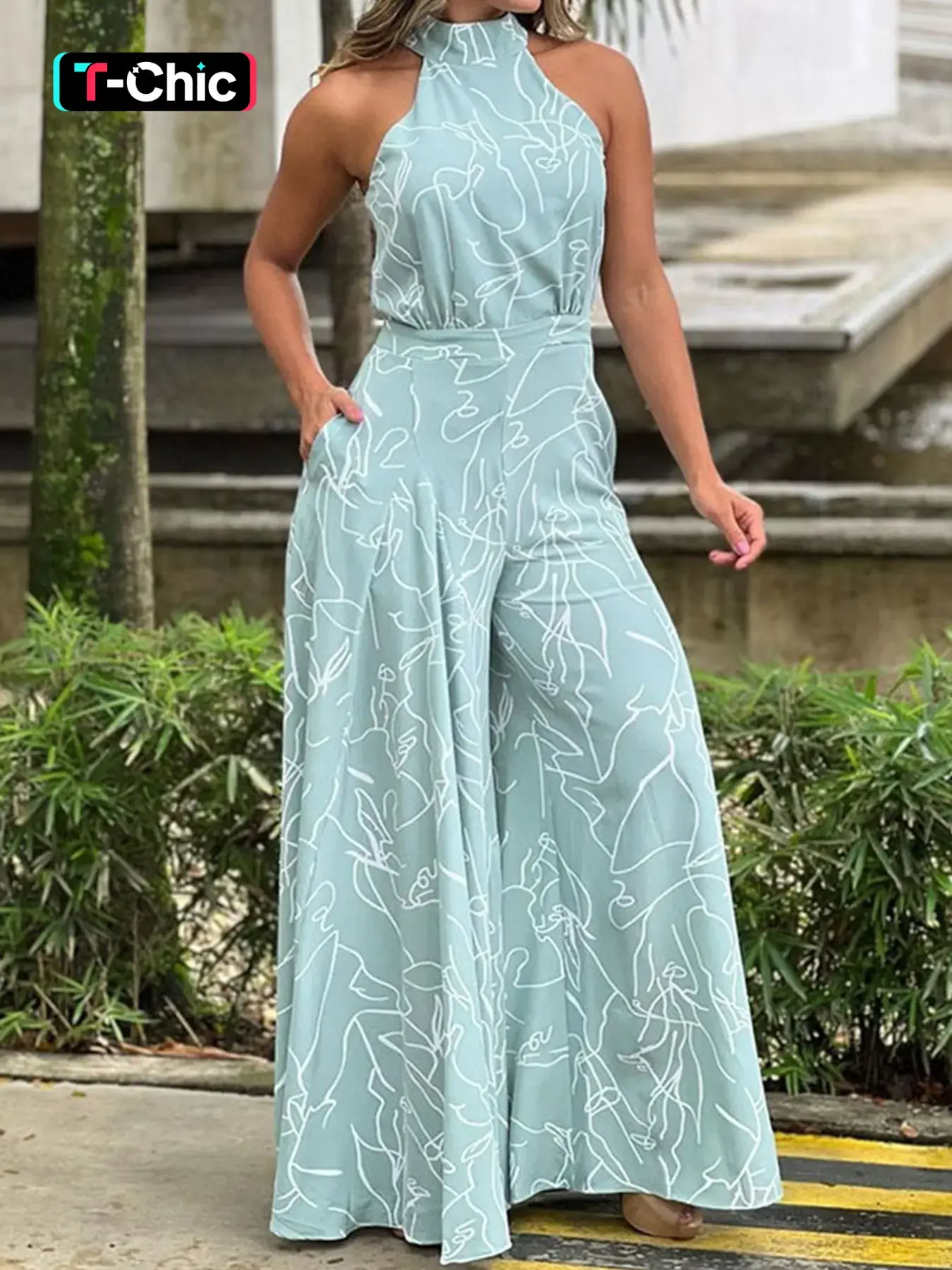 Elegant High-Waisted Wide-Leg Romper Jumpsuit, Artistic Print Halter Neck Sleeveless Design, Slimming Effect, Perfect for Vacation Style