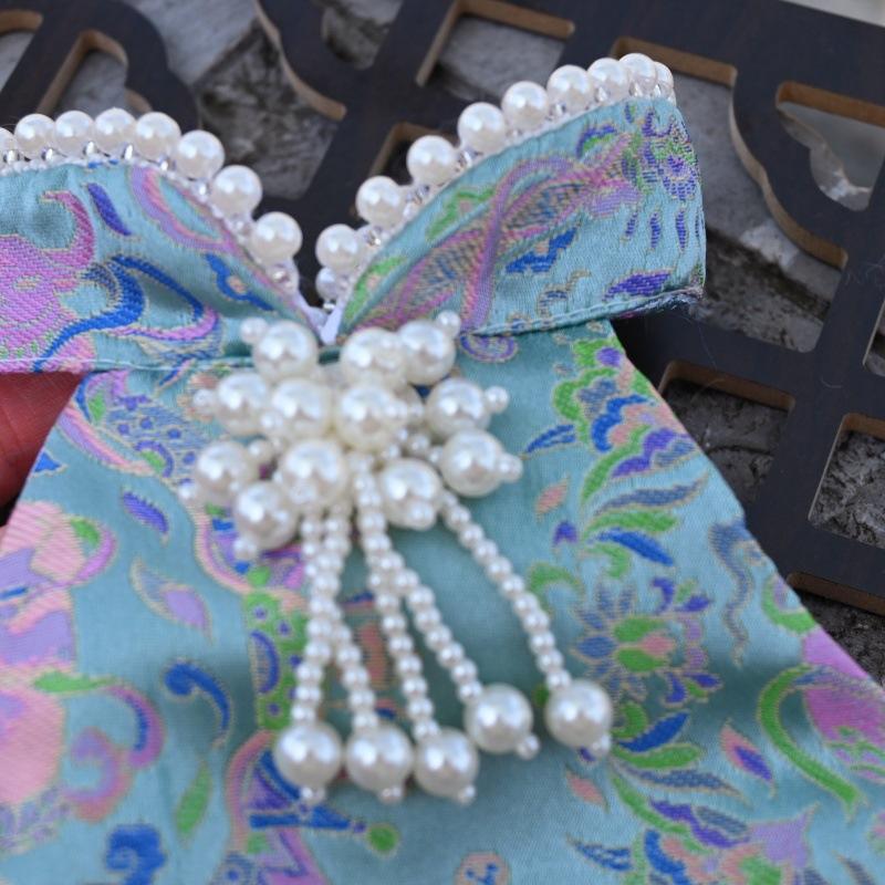 Paws Trendy Pet Spring & Summer Qipao for Dogs & Cats, suitable for Teddy, Bichon Frise and other small dogs. Features embossed fabric with exquisite retro frog buttons, fine workmanship, exuding noble elegance and making your beloved pet stand out.
