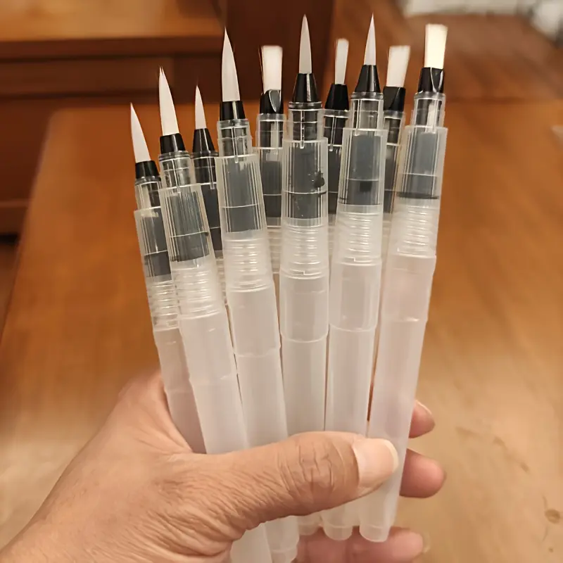 12 solid-color watercolor pens with filled brush heads, pointed flat heads and ergonomic grooved handles - transparent ink cartridges suitable for detailed painting, calligraphy and water storage pens