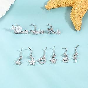 Trendy Summer 9 PCS Dangle Nose Rings - L Shaped for Women, 20G Stainless Steel Nose Rings Studs with CZ Cross, Crown, Flower, Heart Dangling Piercing Jewelry Trendy Summer 9 PCS Dangle Nose Rings - L Shaped for Women, 20G Stainless Steel Nose Rings Studs with CZ Cross, Crown, Flower, Heart Dangling Piercing Jewelry