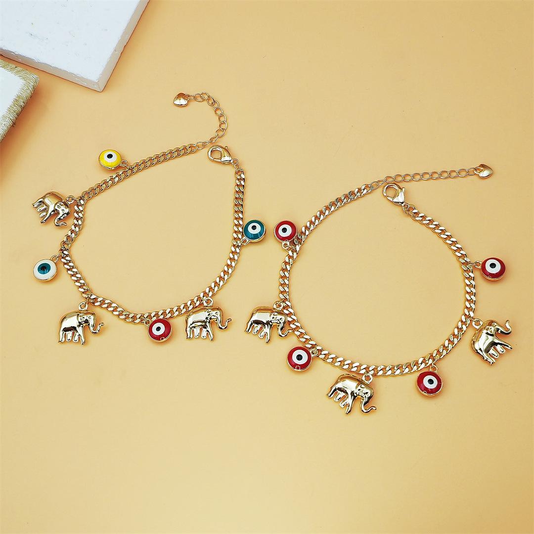 Gold Devil's Eye Bracelet with Baby Elephant Pendant Adjustable Length for Stylish Accessory SpringStatements