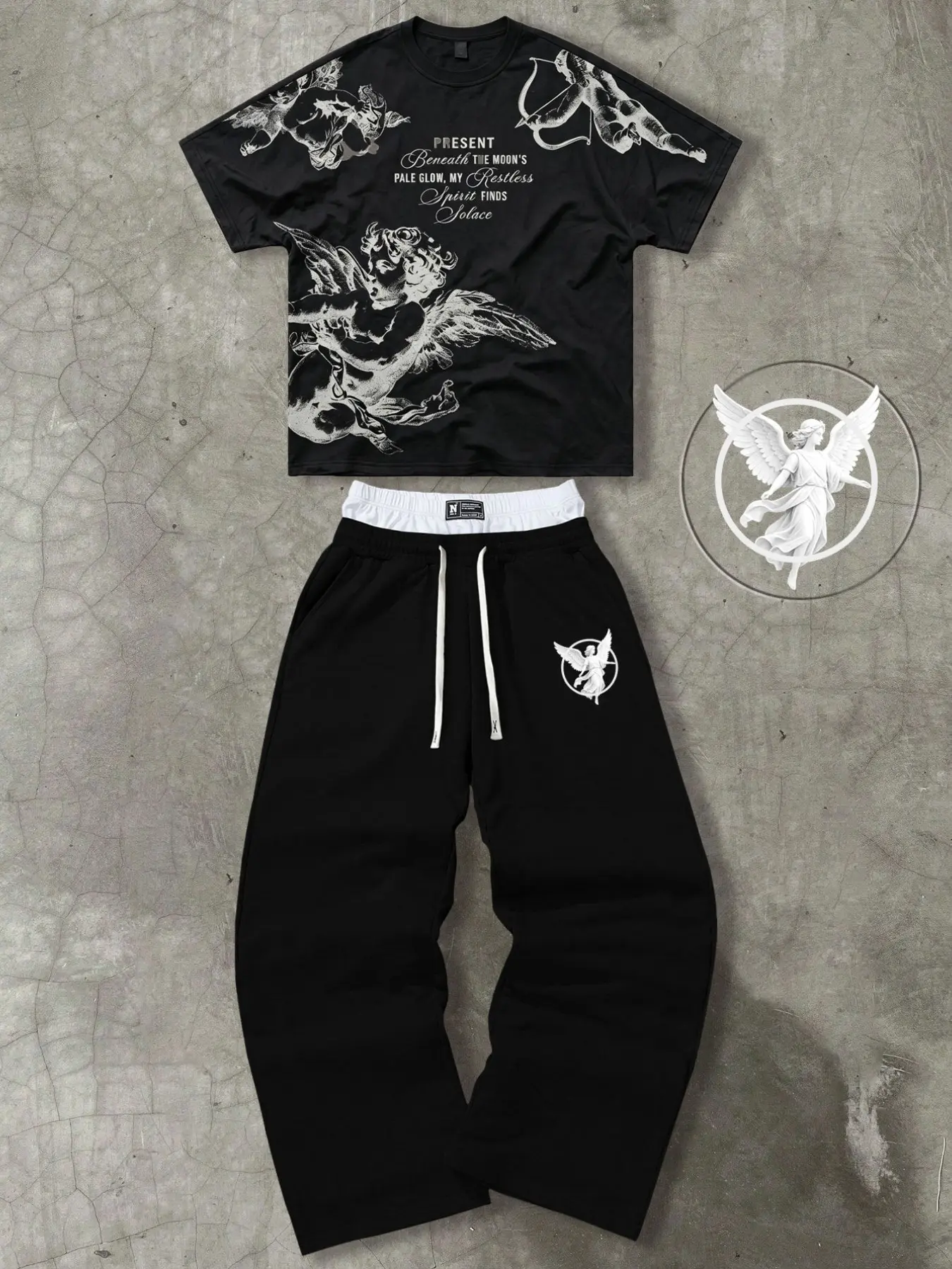 The men's two-piece set, featuring a vintage angel print, includes a men's Renaissance print short-sleeved T-shirt and a pair of double-waisted loose-fitting sweatpants.