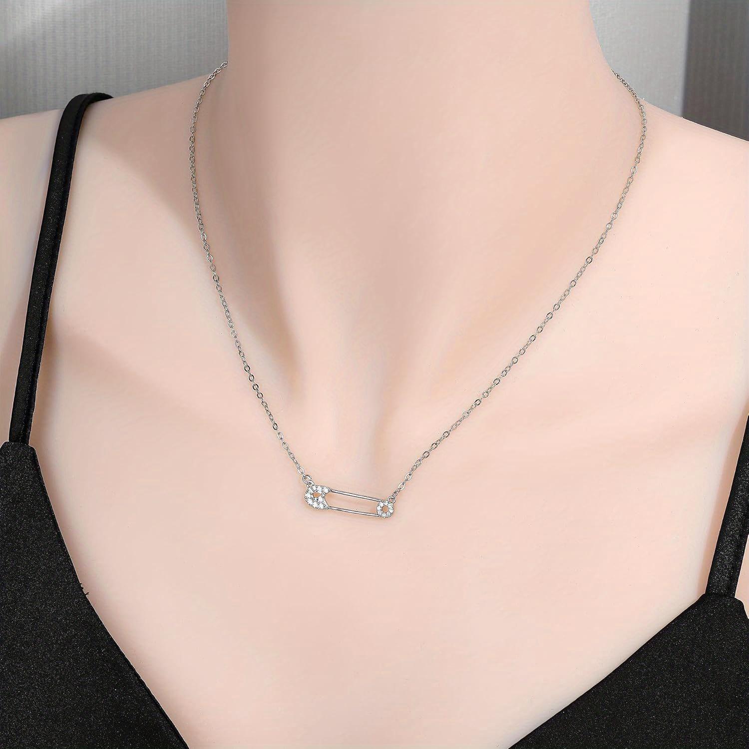 A Stylish Necklace Collar for Women Featuring Safety Pins niki safety pin necklace