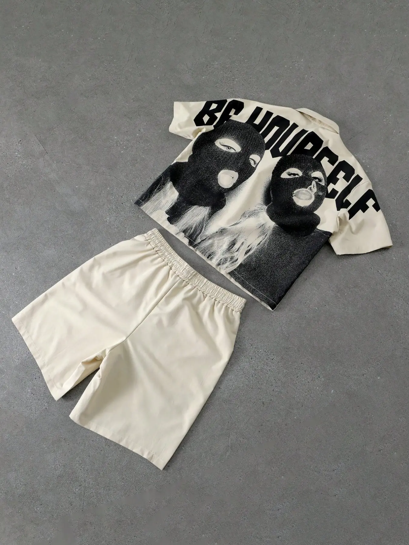 Men's 2-piece short sleeve shirt and shorts set with balaclava figure print, collared design, button front, and drawstring elastic waist