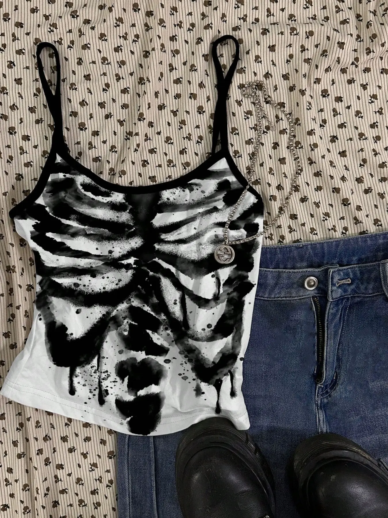 Women's skull and rib-cage print camisole; a cropped, sleeveless top featuring an edgy, Gothic-inspired style—perfect for everyday wear.