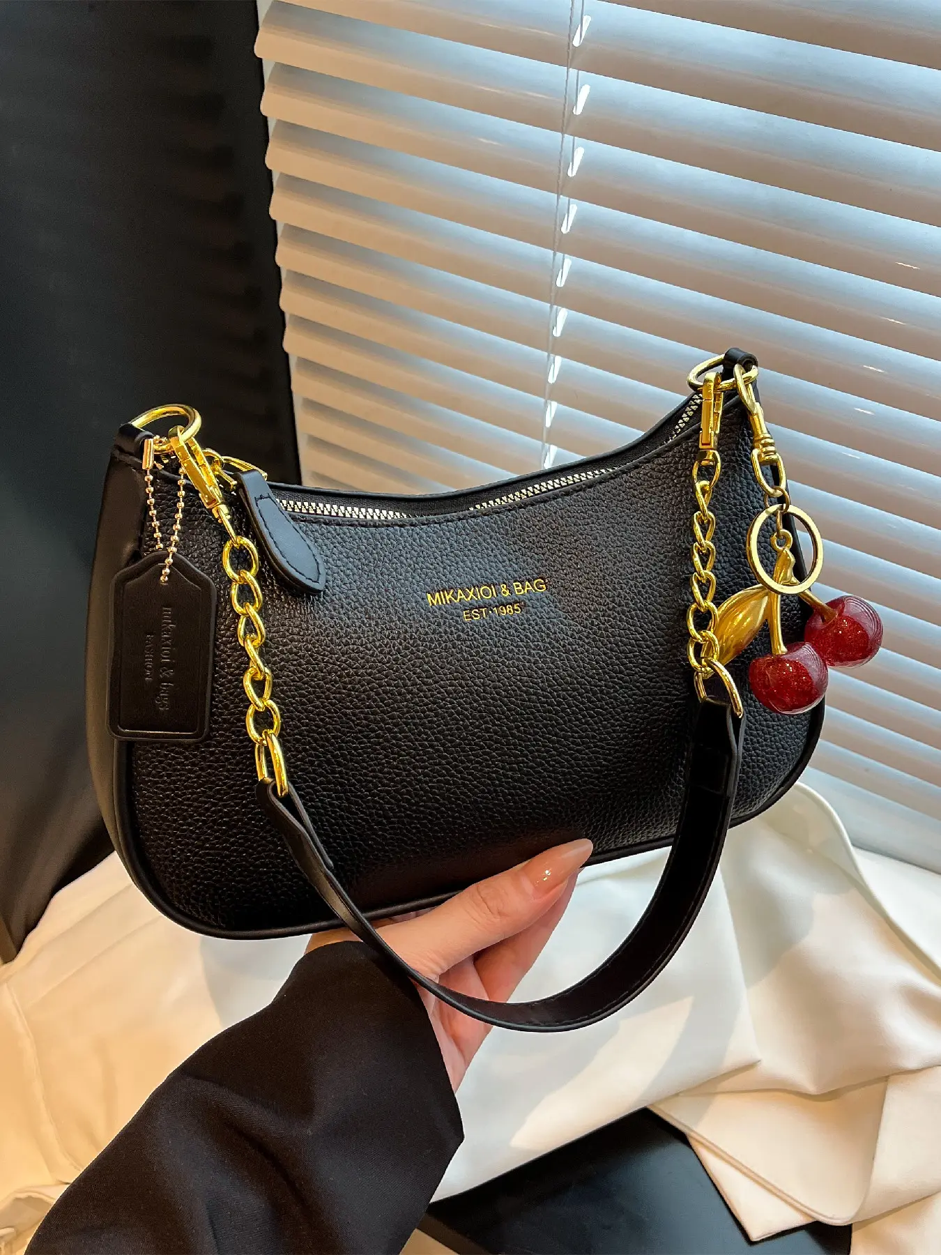 Trendy fashion chain decoration letter design, one shoulder armpit bag that can be carried by hand, suitable for work and daily use, with cherry pendant as a gift
