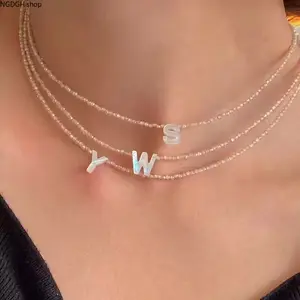 Personalized Shell Bead Necklace - Chic Gold Tone Triple Layer Iridescent Initial Pendant Chain, Delicate Hypoallergenic Comfort Fit, Versatile Trendy Accessory Ideal for Casual Daily Wear Date Night & Coastal Boho Style Vibes