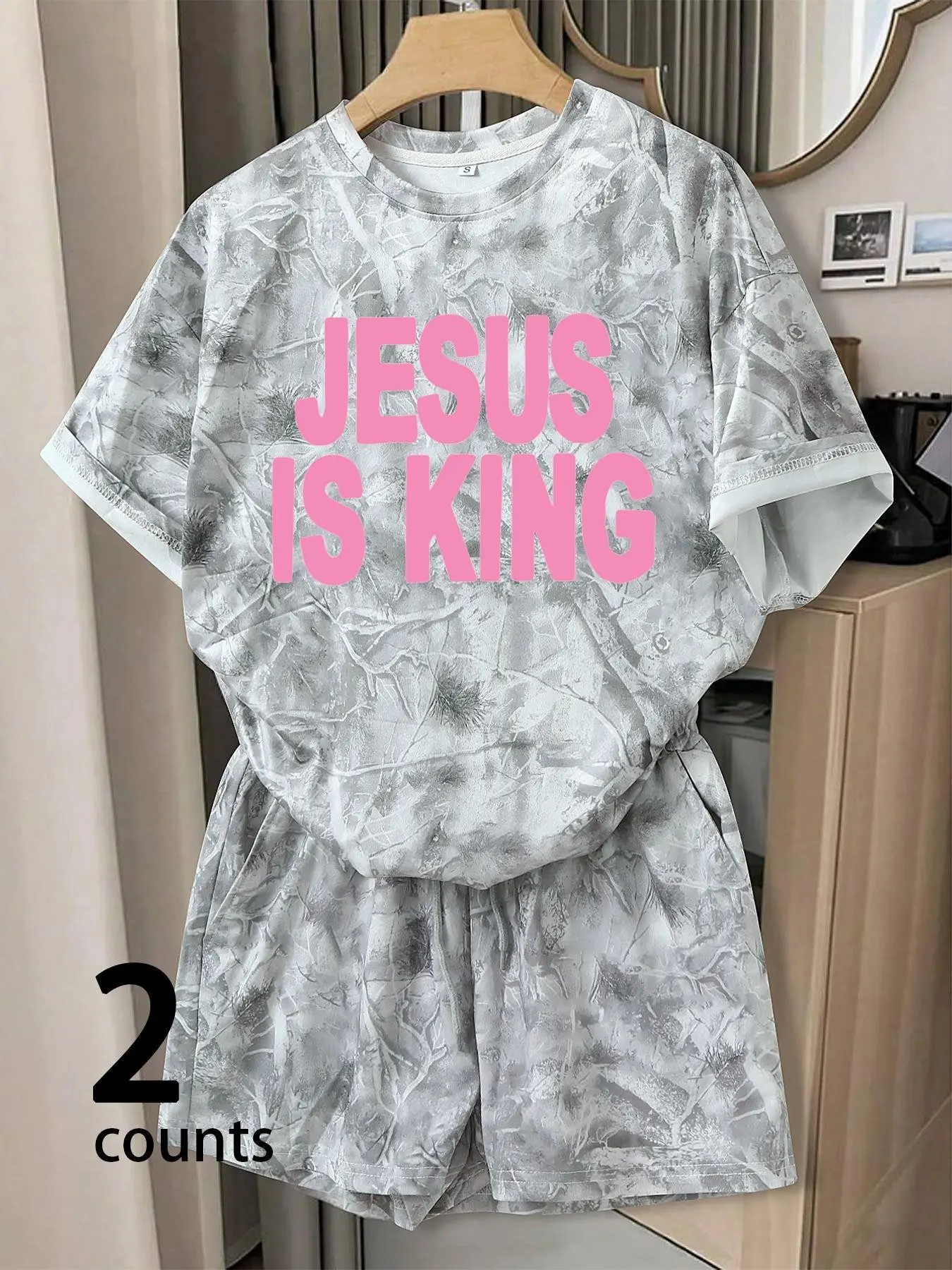 Women's aesthetic grey camo two-piece set featuring a comfortable printed T-shirt and lounge shorts—perfect for everyday wear and TikTok looks.
