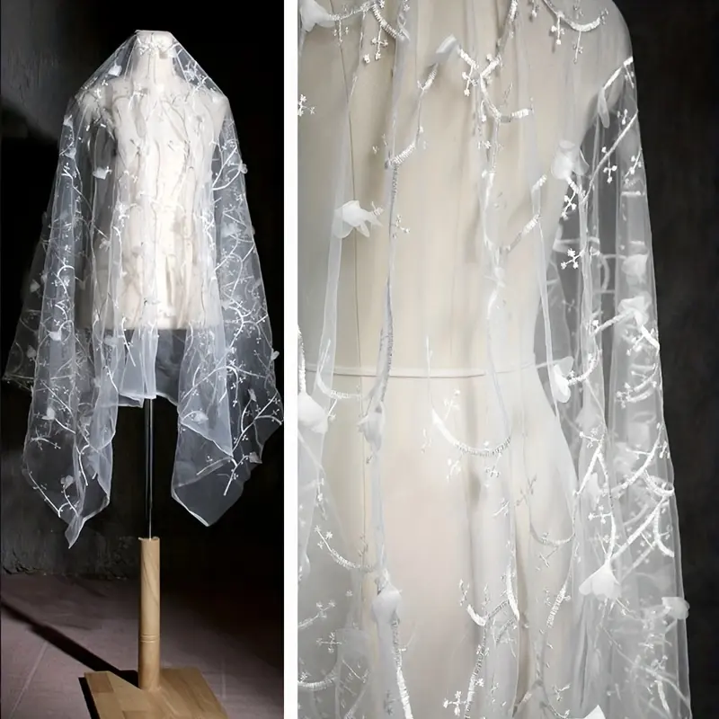 White floral embroidered tulle fabric by the yard, green leaf sheer mesh lace for wedding dresses, bridal veils, and DIY sewing crafts