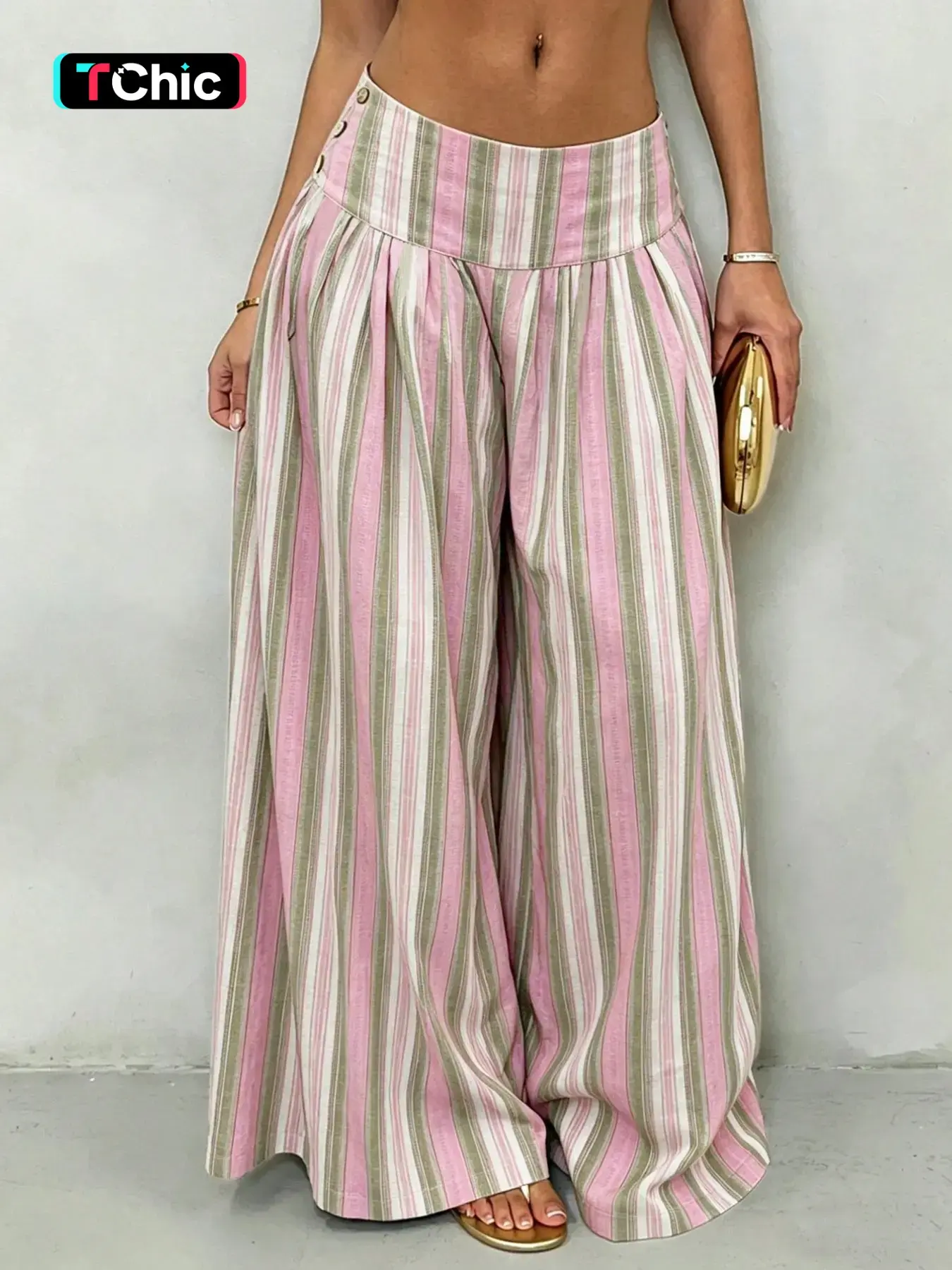 A chic women's striped high-waisted wide leg Beach palazzo pants with side button closure, pleated loose fit and flowing drape, ideal for vacation and daily outings, a stylish boho statement piece