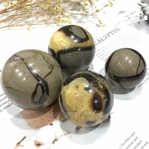 1 rare seven colored dragon stone ball with natural crack patterns and earthy tones, smooth and polished surface, natural yellow calcite with dragon patterns, Bohemian home decoration, office decoration, earthy aesthetic style, handmade by craftsmen, the