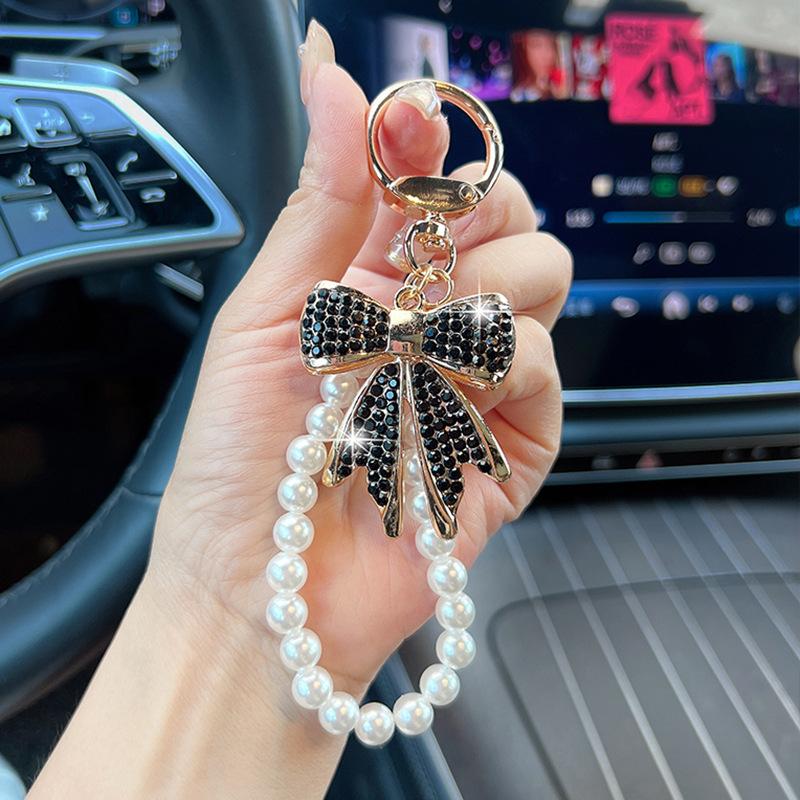 Rhinestone Bow Keychain with Pearl Wrist Strap, Luxury Bling Bow Car Key Ring, Elegant Metal Bag Charm Accessory for Women Rhinestone Bow Keychain with Pearl Wrist Strap, Luxury Bling Bow Car Key Ring, Elegant Metal Bag Charm Accessory for Women