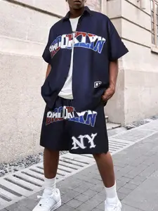 Men’s navy blue Brooklyn print 2-piece set, short-sleeve button-up shirt and drawstring shorts, “Brooklyn” and “NY” graphic design, relaxed fit, lightweight fabric, casual streetwear style, everyday wear, matching loungewear