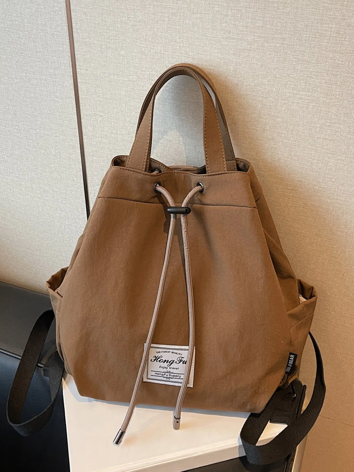 Solid color casual simple style drawstring backpack, Commuter backpack, with a large capacity and a relaxed feeling, can accommodate tablets and files, suitable for daily commuting and campus classes