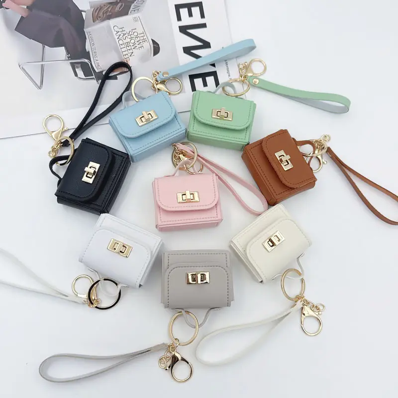 Creative mini PU leather handbag keychain, with a leather handle, coin purse, and phone charm gift, easy to carry, suitable for all kinds of bags, lightweight keychain, stylish keychain, small key storage bag