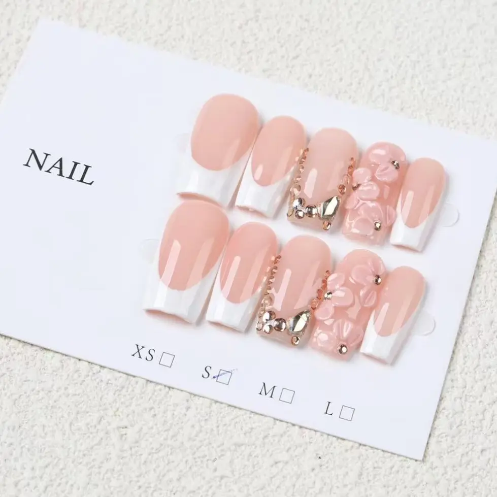 10-Piece Set of Nude Pink French-Style Press-On Nails, False Nail Set, medium-length rectangular artificial nails with 3D pink floral accents, V-shaped gold rhinestones, glossy finish, reusable