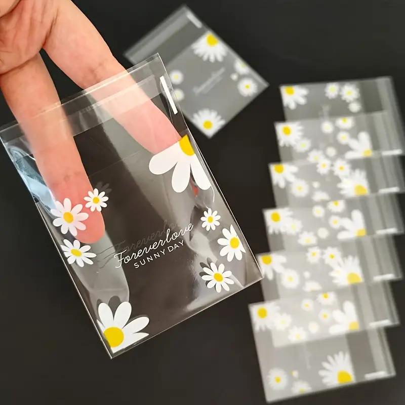 100pcs daisy print gift bag, transparent self-adhesive small packaging bag suitable for wedding return gifts, birthday tea parties, small gift packaging, independent packaging bags for biscuit baking all year round
