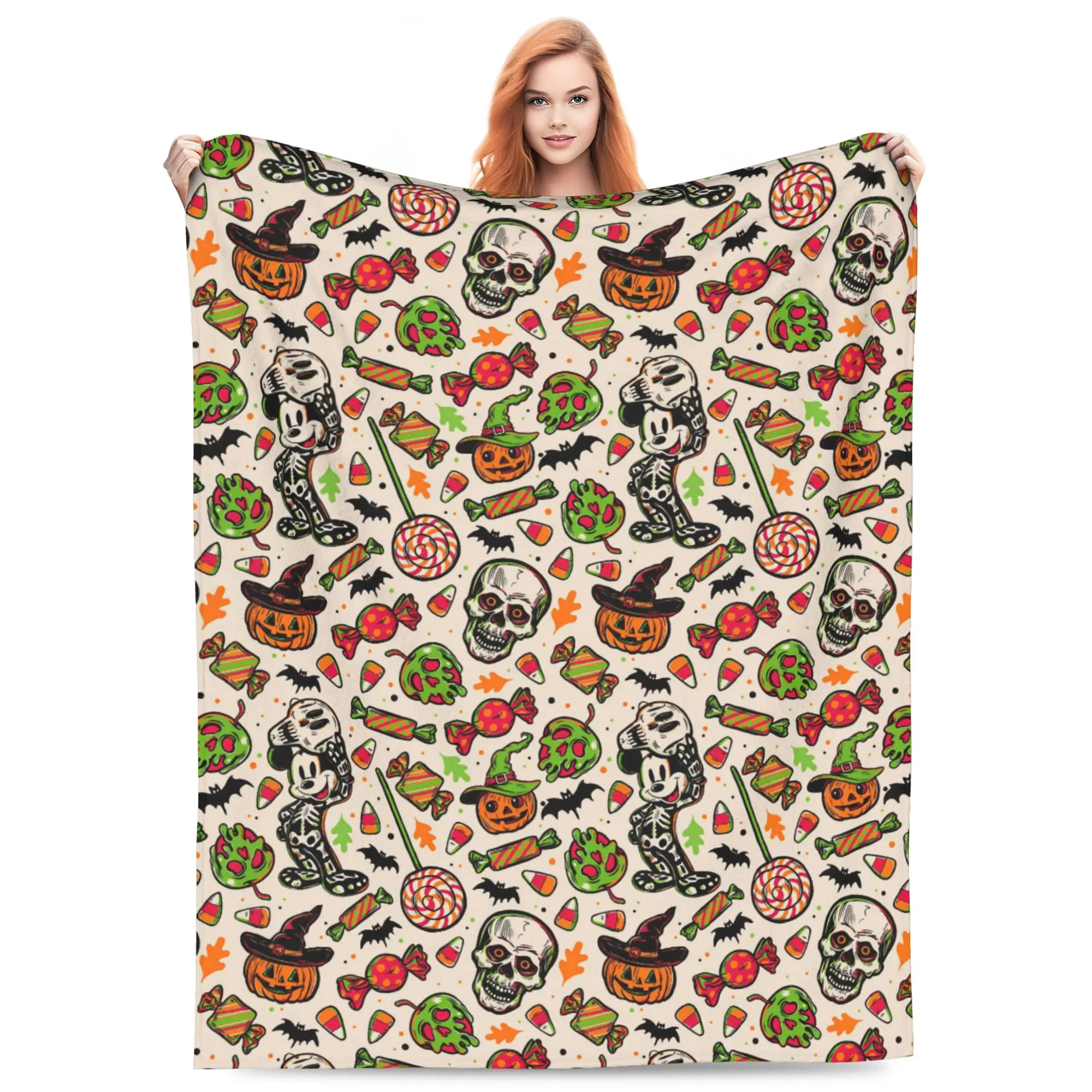 DISNEY CLASSIC Skeleton Mickey Halloween Flannel Blanket. Skeleton Mickey, jack-o-lantern, skull candy, bat & green monster repeat print. Soft cozy throw for sofa bed, gift for spooky Disney Halloween fans.