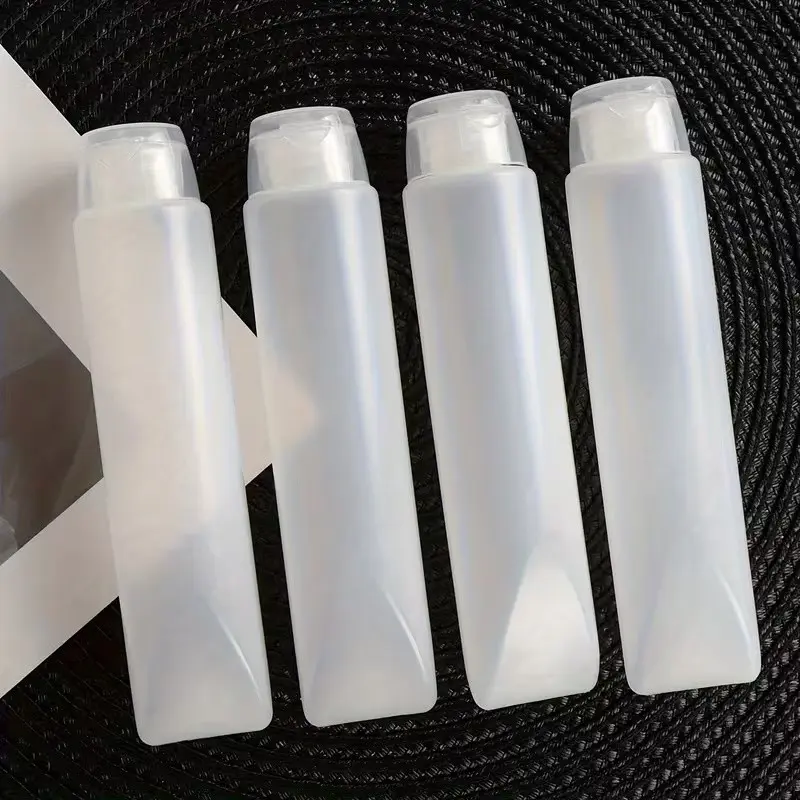 Four-Piece Portable Travel Bottles, Reusable Makeup Containers, Compact Squeeze Bottles for Travel, Ideal for Bathroom Essentials, Refillable Travel Bottles