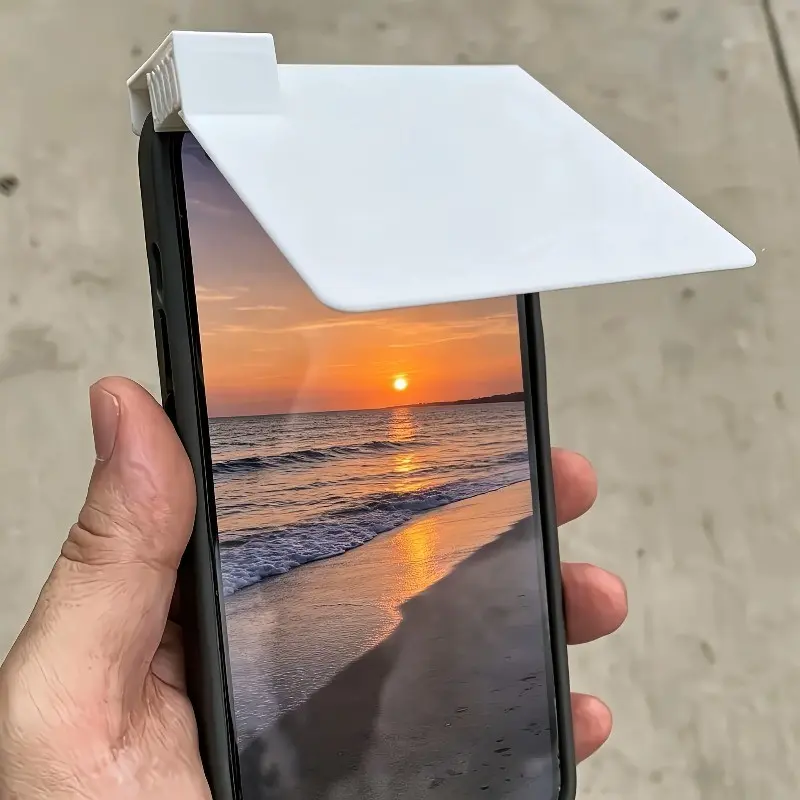 The Mobile Phone Sun Visor Is a Practical Accessory Designed to Enhance the Visibility of the Screen Under Strong Light. It Effectively Reduces the Reflection of Sunlight, Allowing Users to See the Screen Clearly Even Under Direct Sunlight.