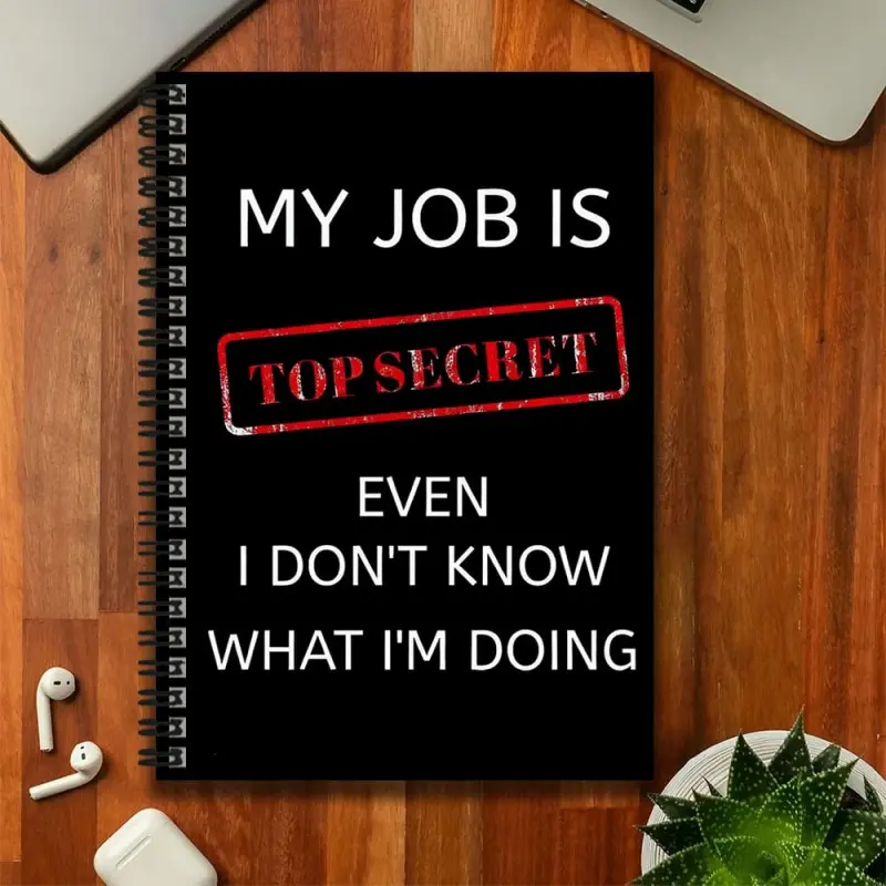 A fun spiral-bound notebook suitable for both work and study, with the cover printed with "MY JOB IS TOP SECRET EVEN I DON'T KNOW WHAT I'M DOING," in a humorous style. Can be used as a graduation gift, birthday present, for journaling, daily planning, and