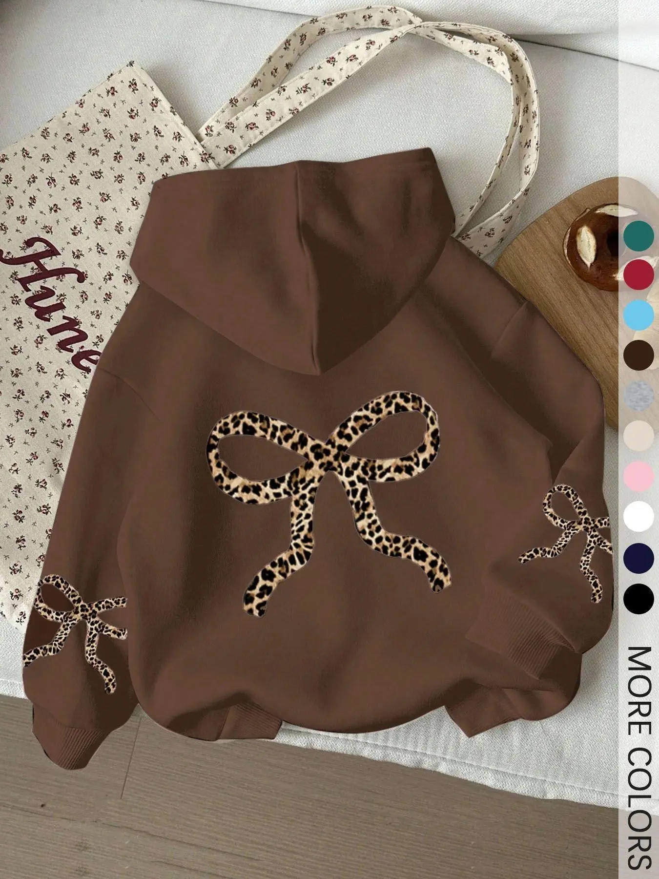 Women's brown loose-fit pullover hoodie for autumn and winter, featuring a leopard-print bow design; a relaxed, long-sleeved streetwear-style hoodie that is warm, comfortable, and perfect for everyday wear. Casual Hooded Top
