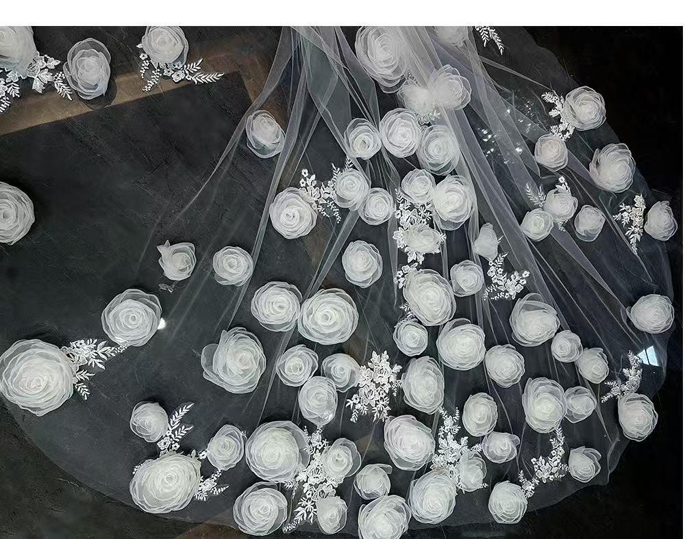 Luxury-style long veil with dreamy, elaborate floral designs and a cathedral-style train