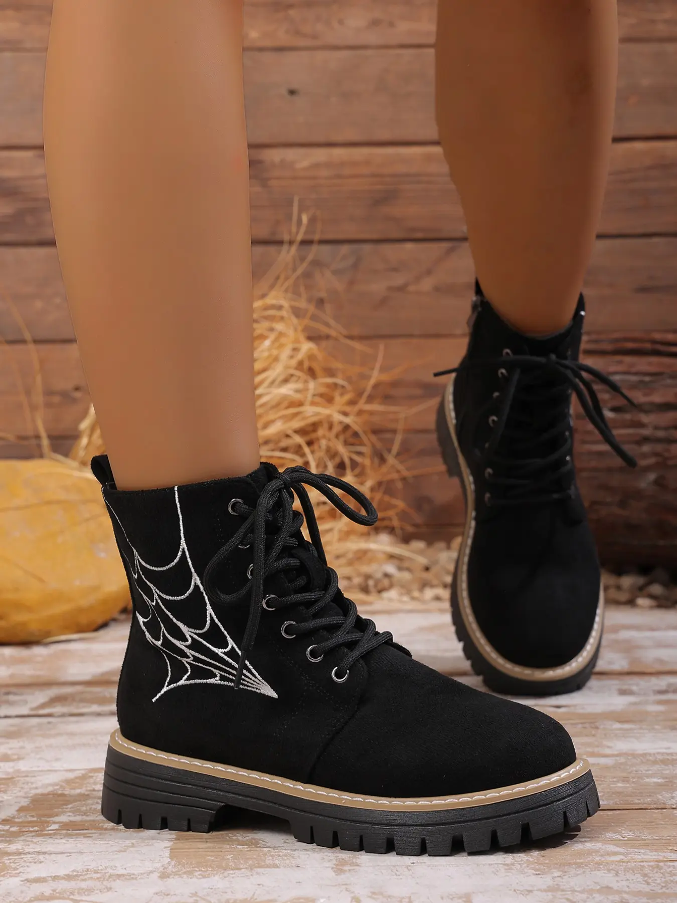 Spider web embroidered combat boots with lace-up front and side zipper, chunky platform sole and round toe, edgy footwear perfect for themed events, concerts and bold everyday styling