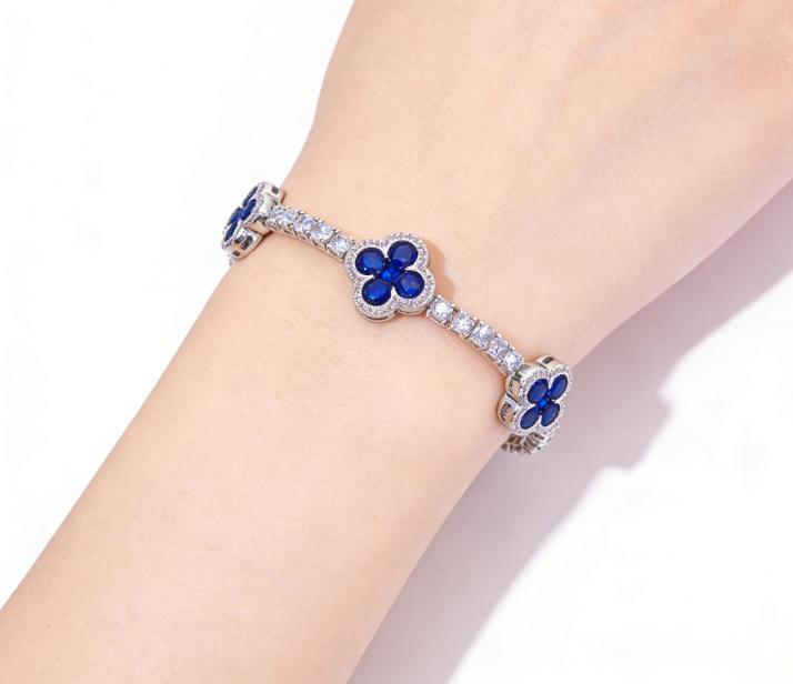 Paired with a 5A+ Sri Lankan Moissanite bracelet, featuring a four-leaf clover motif, colorful gemstone inlay, and a classic tennis chain design—crafted exclusively for women. This piece embodies a luxurious yet minimalist aesthetic, making it an ideal ch