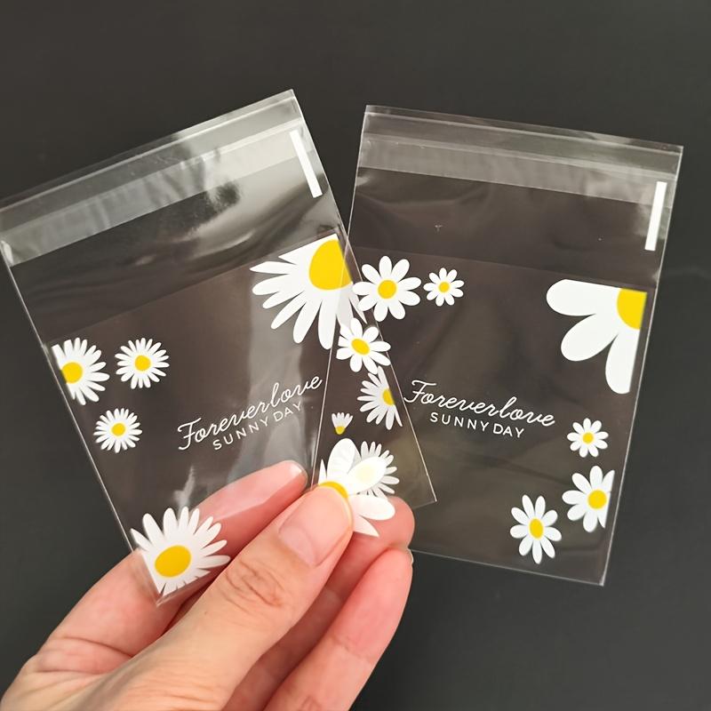 100pcs daisy print gift bag, transparent self-adhesive small packaging bag suitable for wedding return gifts, birthday tea parties, small gift packaging, independent packaging bags for biscuit baking all year round