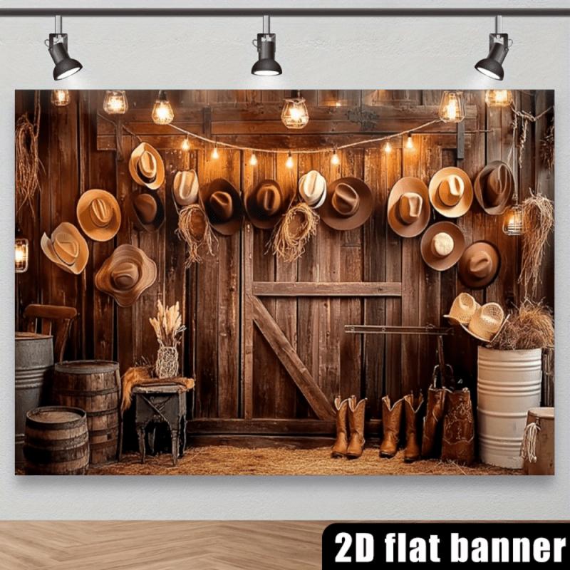 2D Western Cowboy Style Backdrop with a Wooden Barn Door, Hanging Cowboy Hat, Hay Stacks, Wooden Barrel, Metal Bucket, Cowboy Boots, Decorative String Lights, Hay, Vintage Small Table, Glass Jars, and a Dark