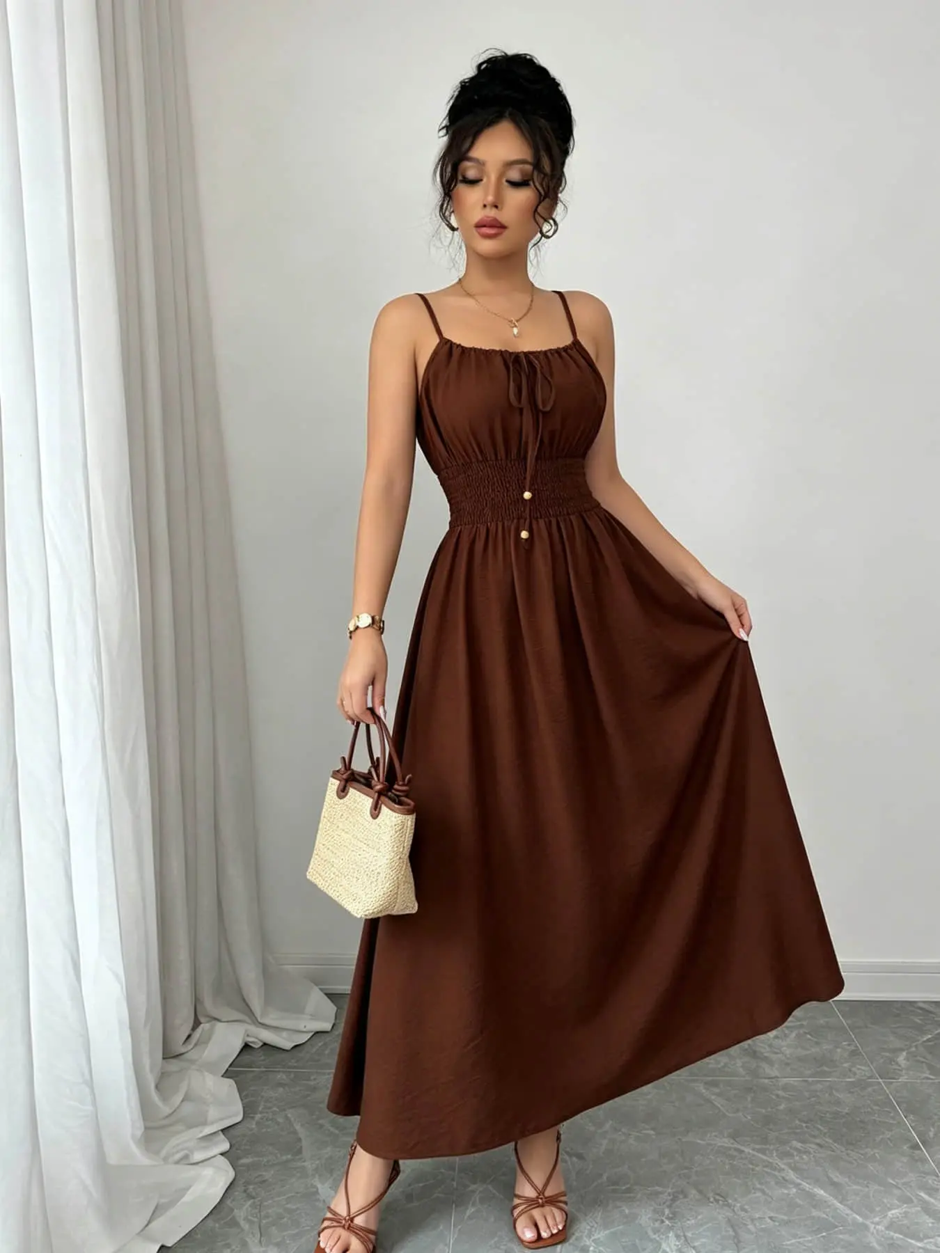 A women's fashionable and high-end French gentle style waist cinching spaghetti strap camisole dress with lace up bead design, suitable for summer, beach wear, dates, dinners, and travel.