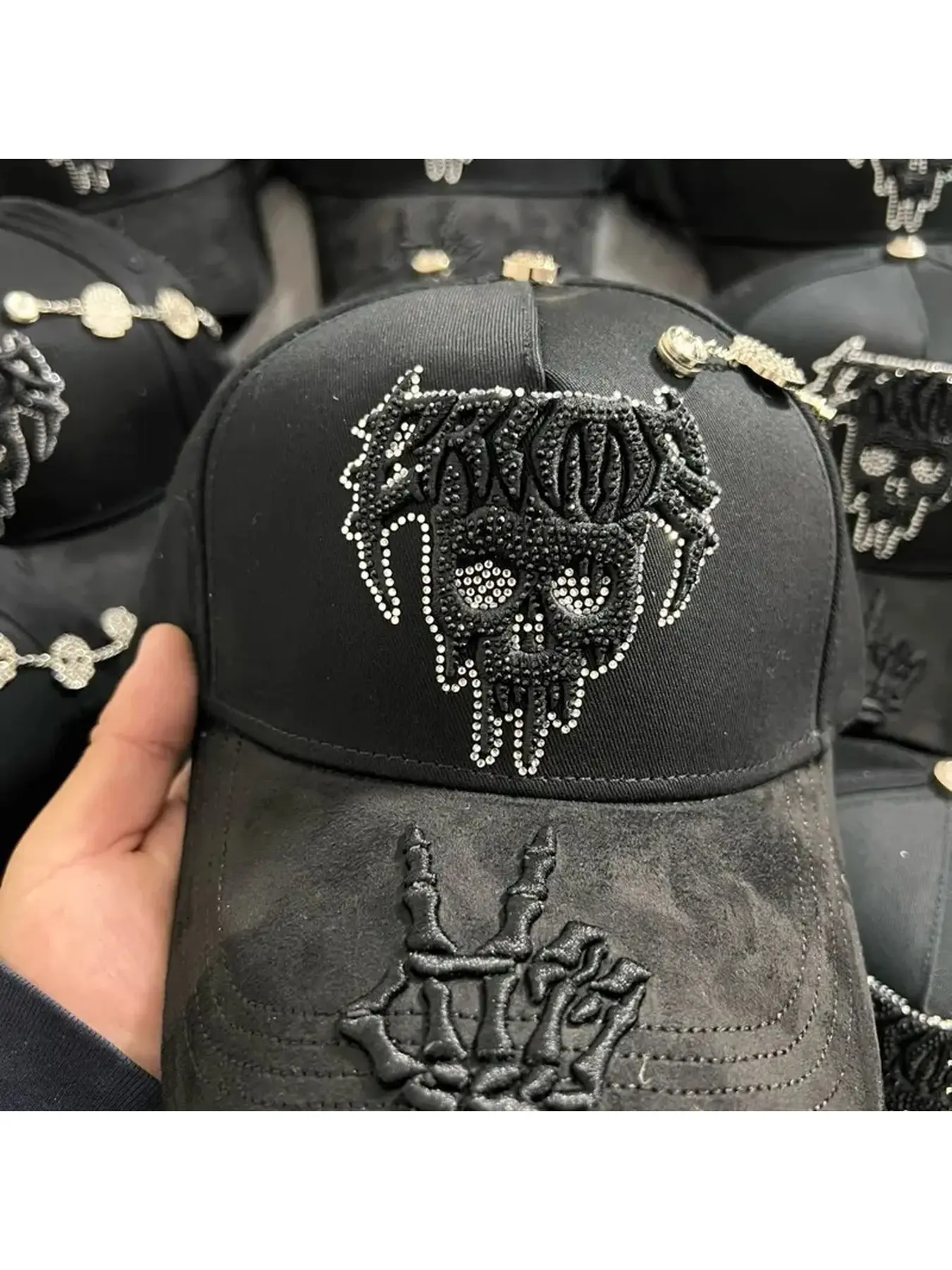 CR*ME black hat with skull pattern and pearl decoration, creating a unique style.